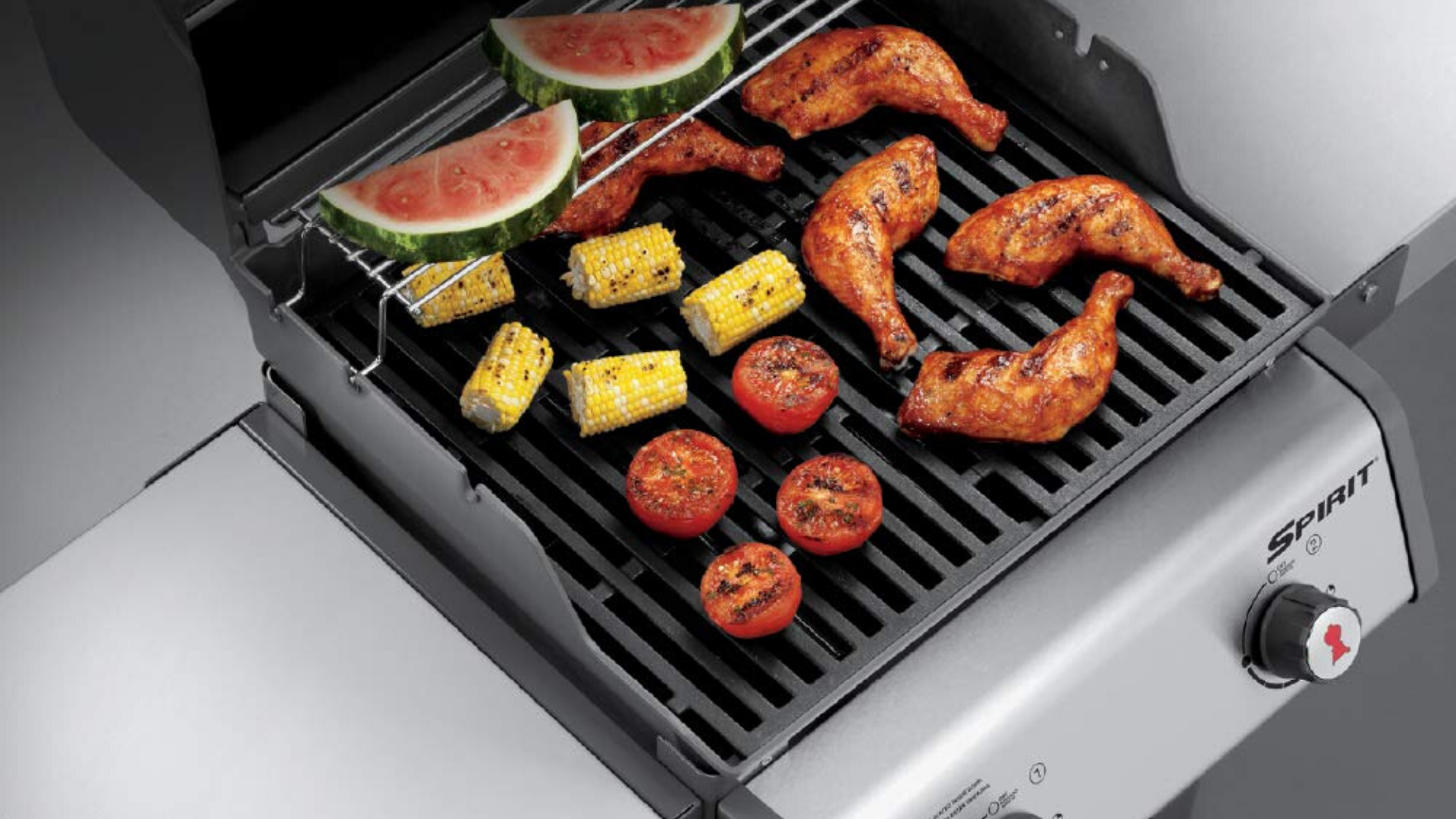 image of watermelon corn tomatoes and chicken on weber spirit grill