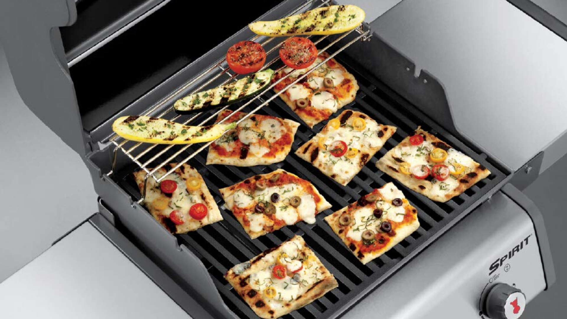 picture of pizza and veggies on weber spirit grill